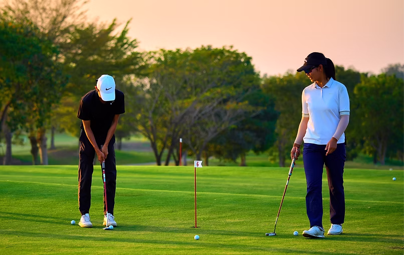 Advanced program students practicing golf