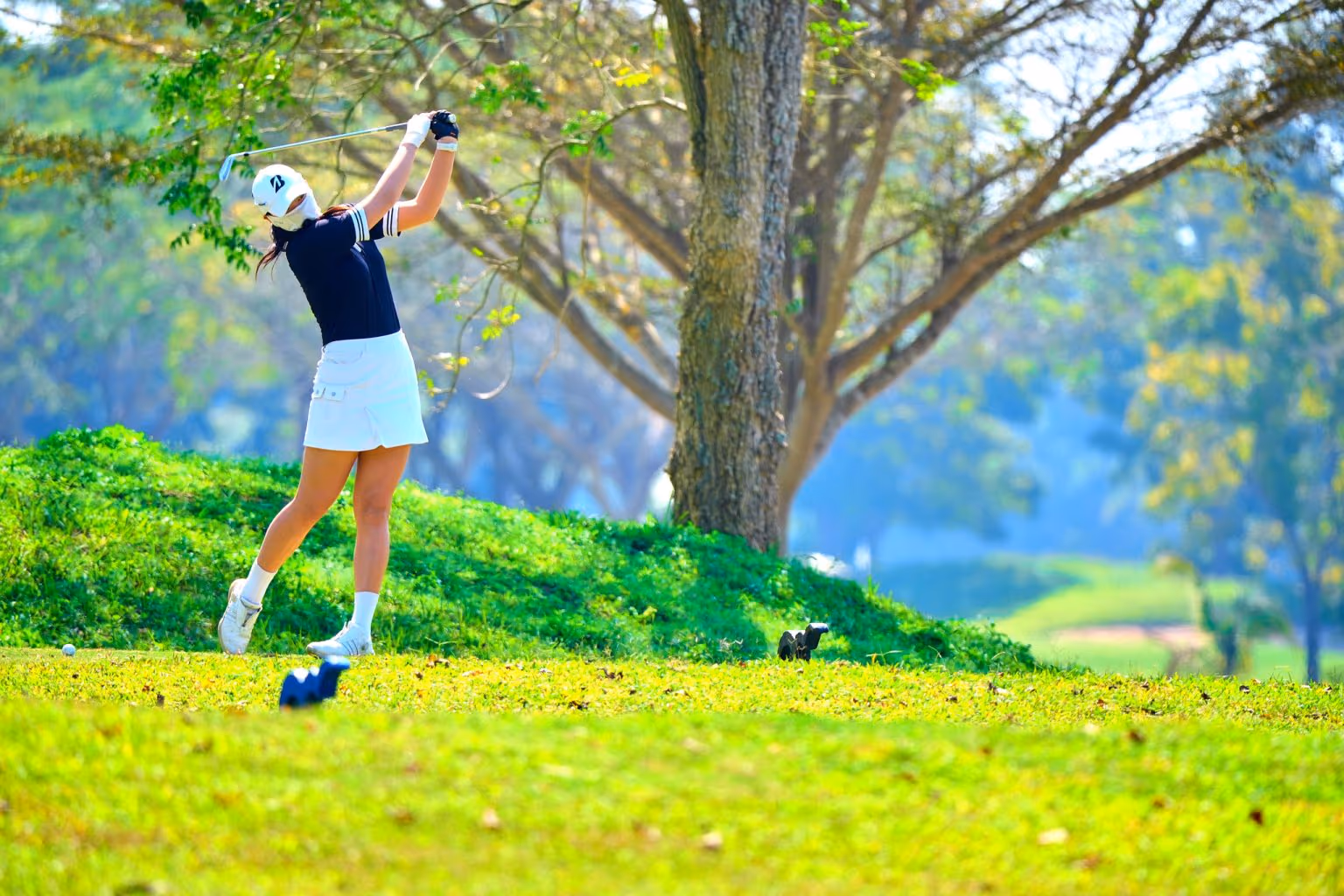 Students practicing on the driving range at a CRIS golf class